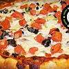 Tomacelli's Pizza & Pasta logo
